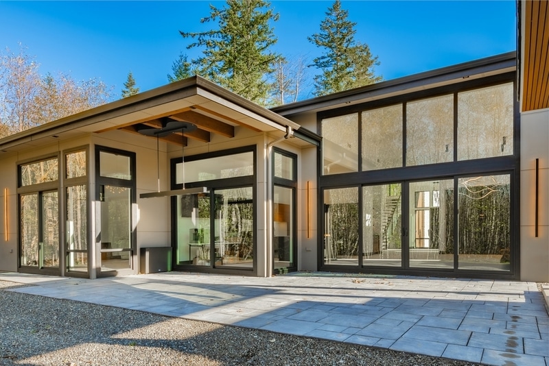 Modern home with minimalist window frames and large glass panels