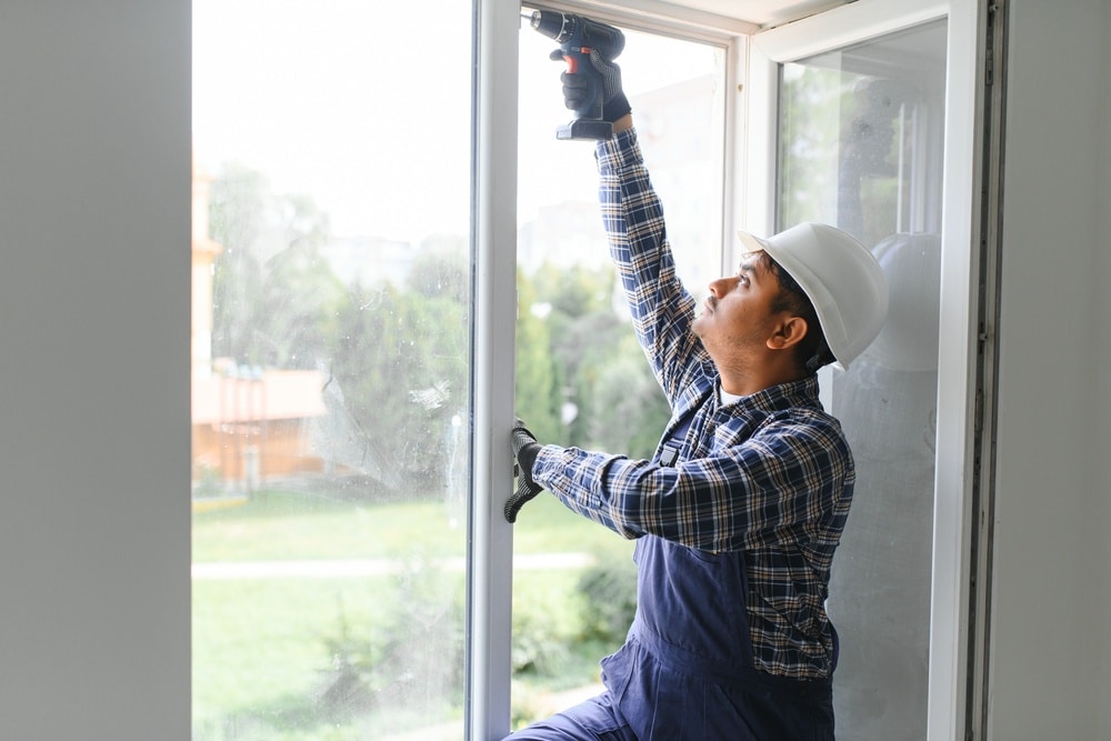 Window installer replacing a window