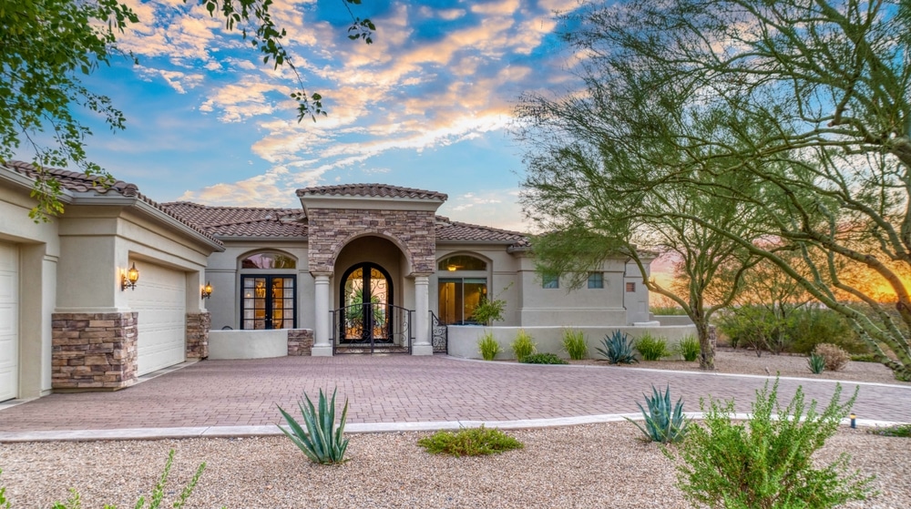 Beige home exterior with black window frames