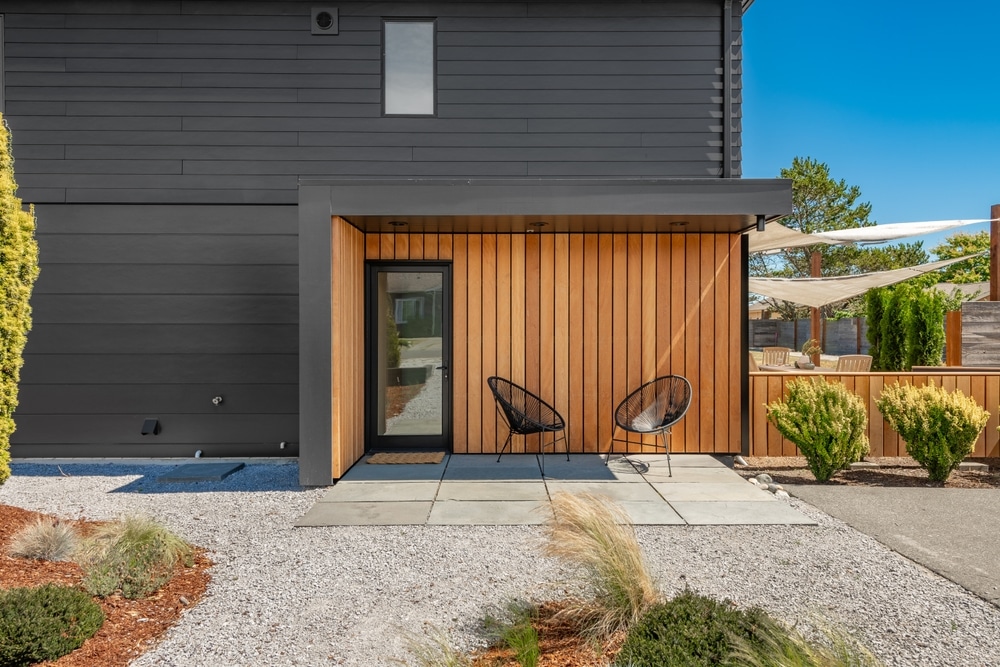 Dark house exterior with black window frames