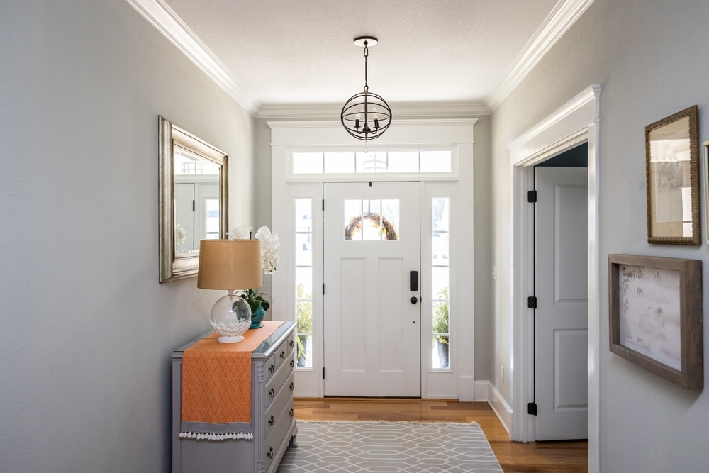 Direct-set transom window above entry door
