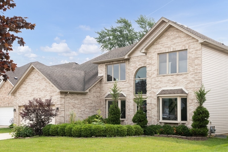 Beige colored exterior window frames on a house